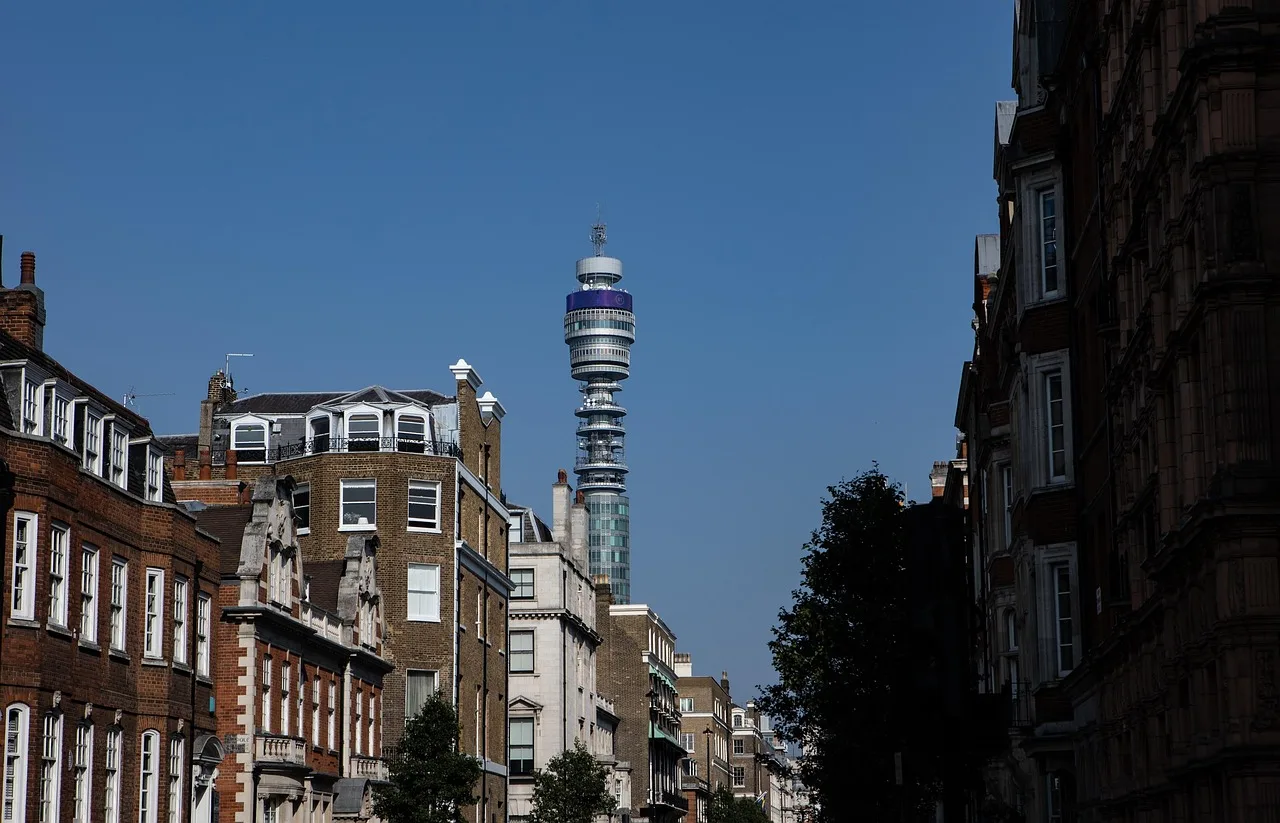 The BT Tower rising above a Fitzrovia street, London