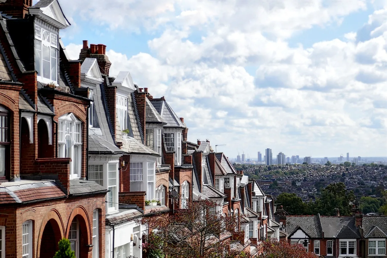 Red-brick Edwardian terraced houses in west London, typical of Acton