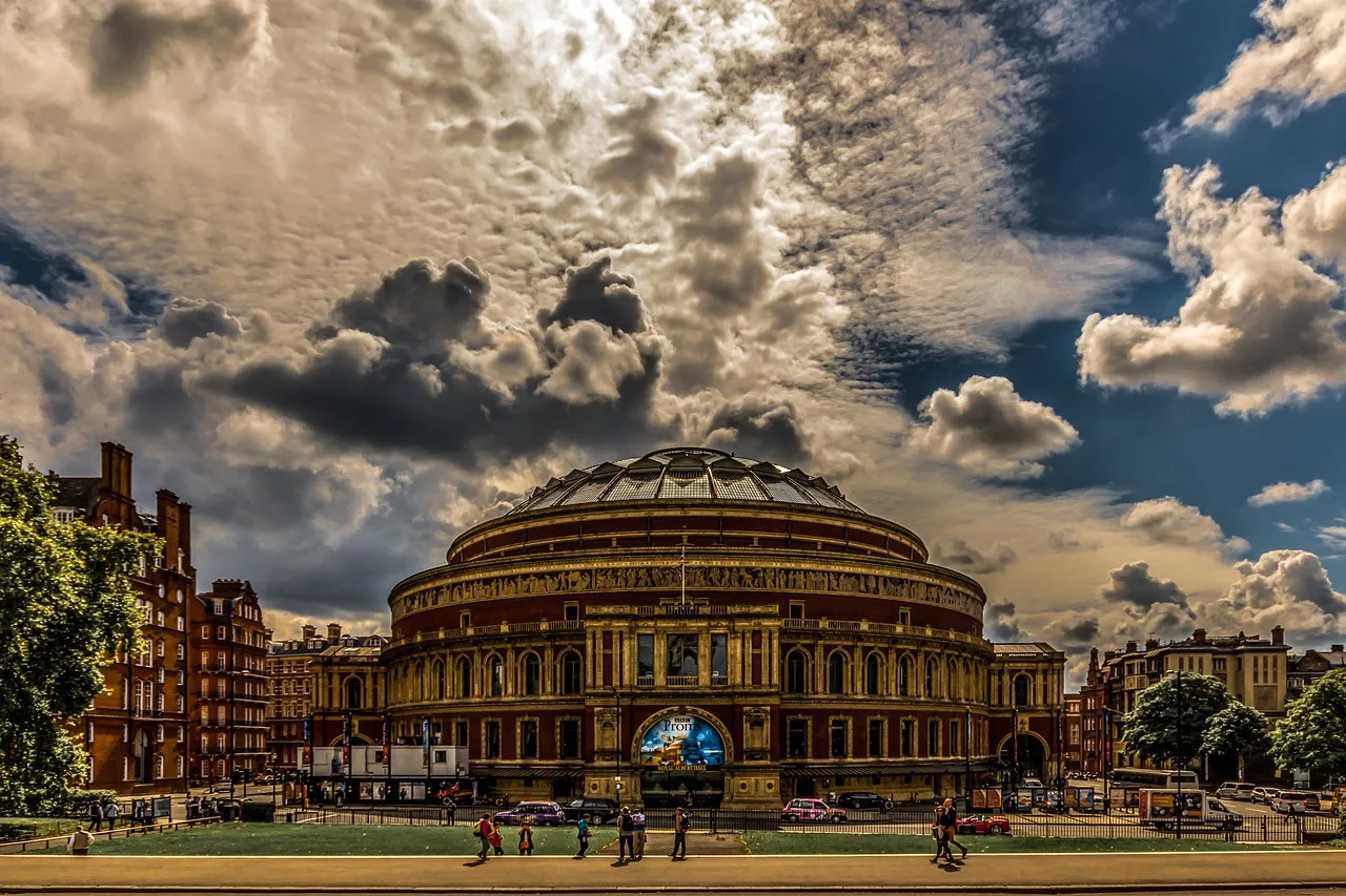 The Royal Albert Hall in Kensington under a dramatic sky