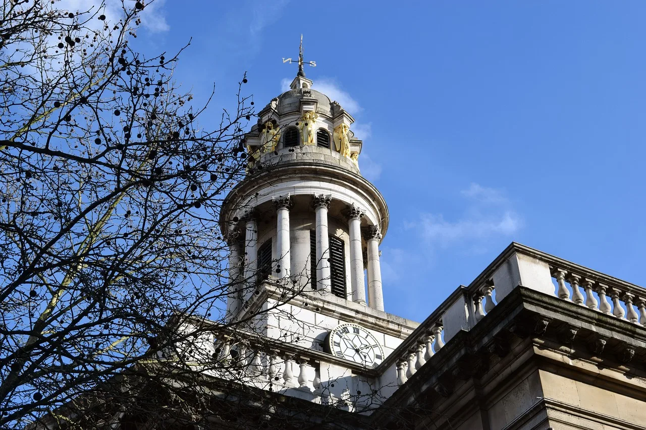The tower of St Marylebone Parish Church against a blue sky