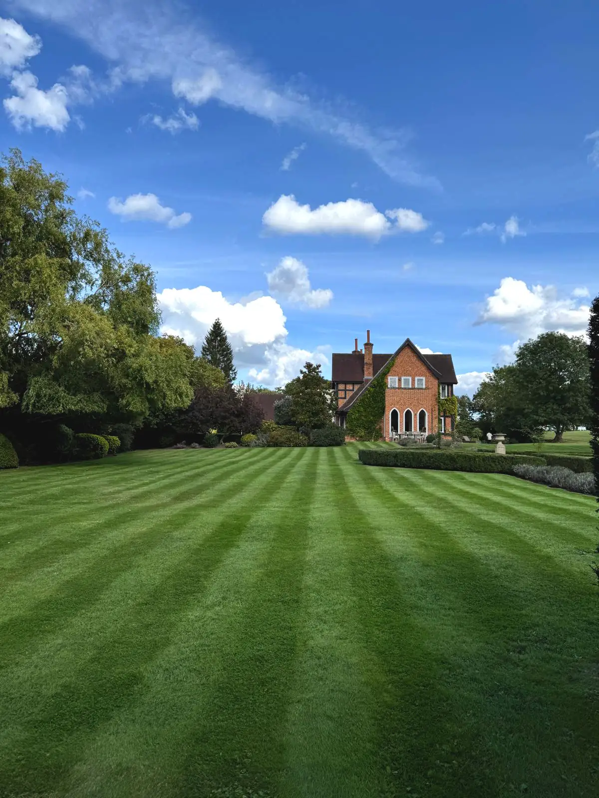 Freshly mown striped lawn at a period property in Weybridge, Surrey Freshly mown striped lawn at a period property in Weybridge, Surrey